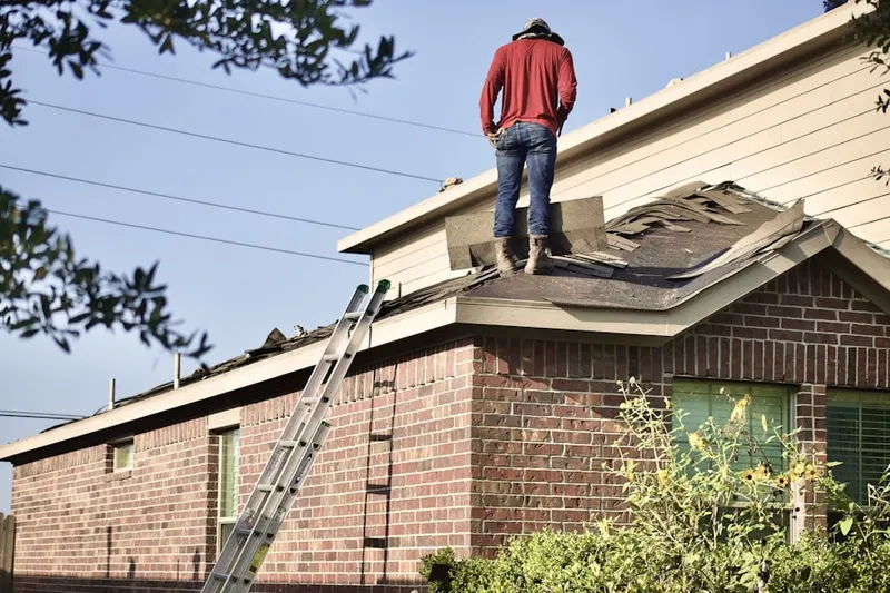 Professional roofer working on a residential roof in Horizon City